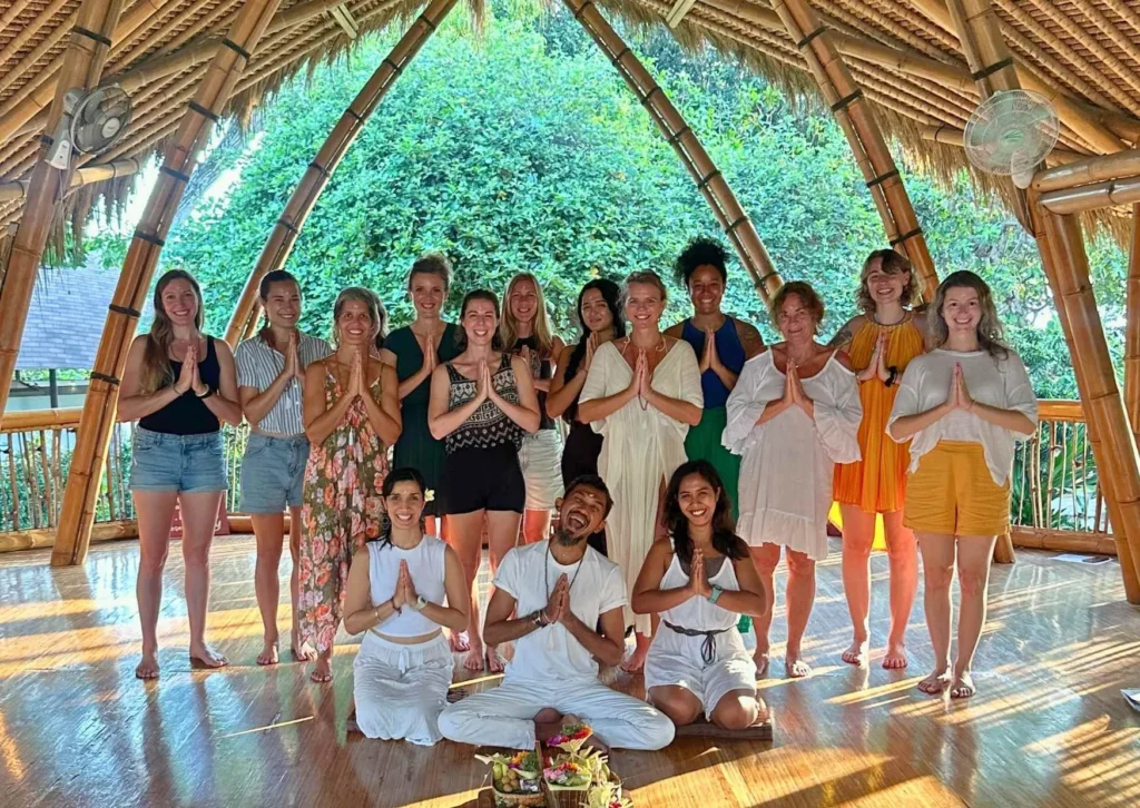 Bali YTT preparation – group of yoga teacher-training students in the bamboo shala at Power of Now Oasis, Bali