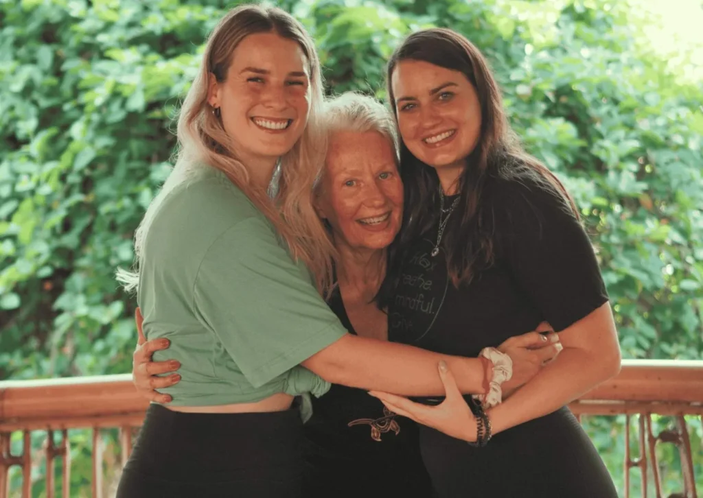 Bali YTT preparation – smiling yoga students hugging their teacher at Power of Now Oasis